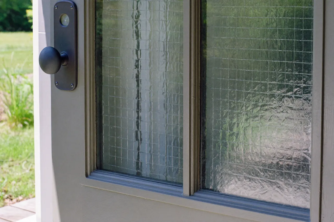 Frosted privacy glazing panel set into a composite front door