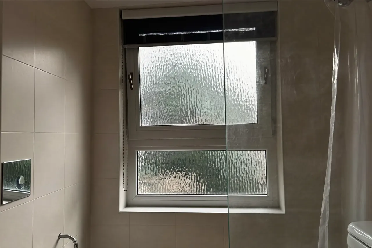 Obscure-glazed bathroom window providing privacy with daylight