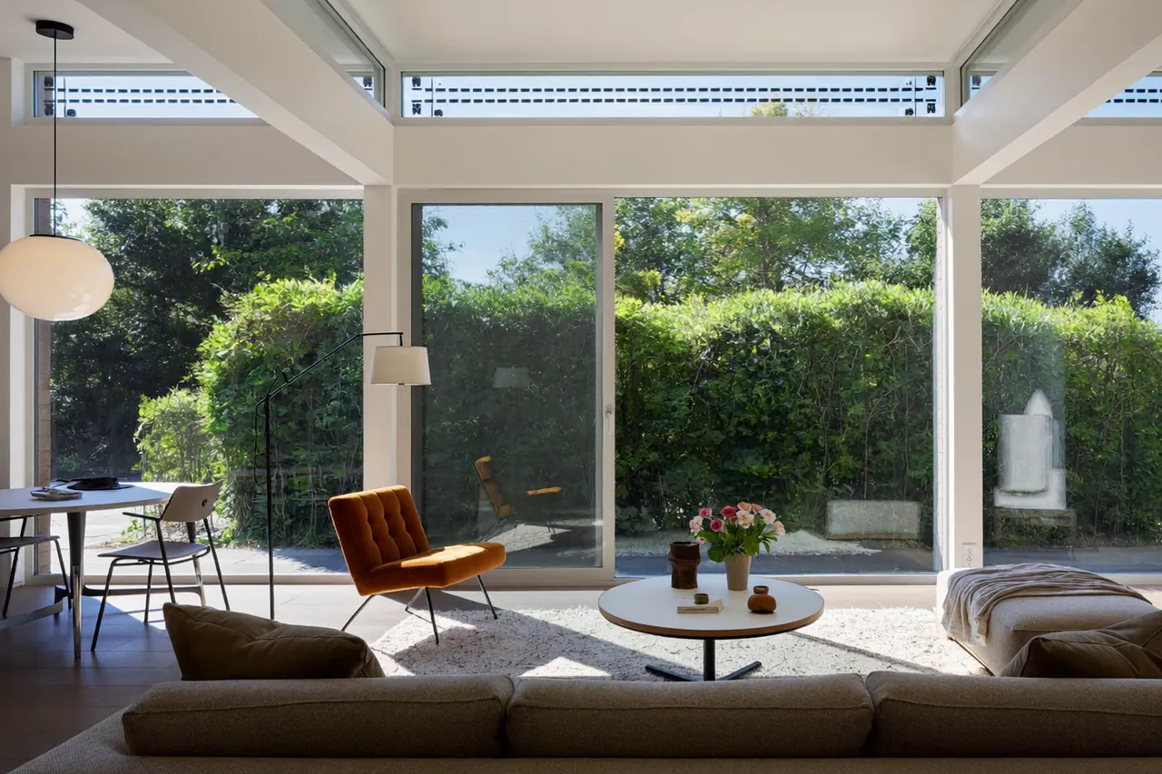 Quiet living room with secondary glazing beside a busy main road