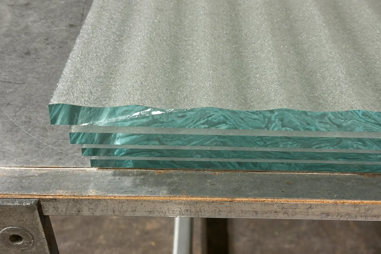 Toughened and laminated safety glass samples shown side by side